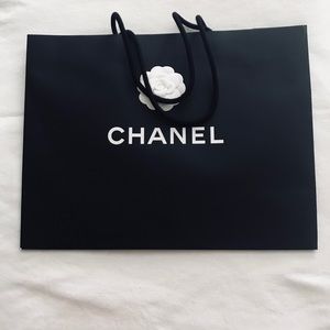 Chanel large empty shopping bags.